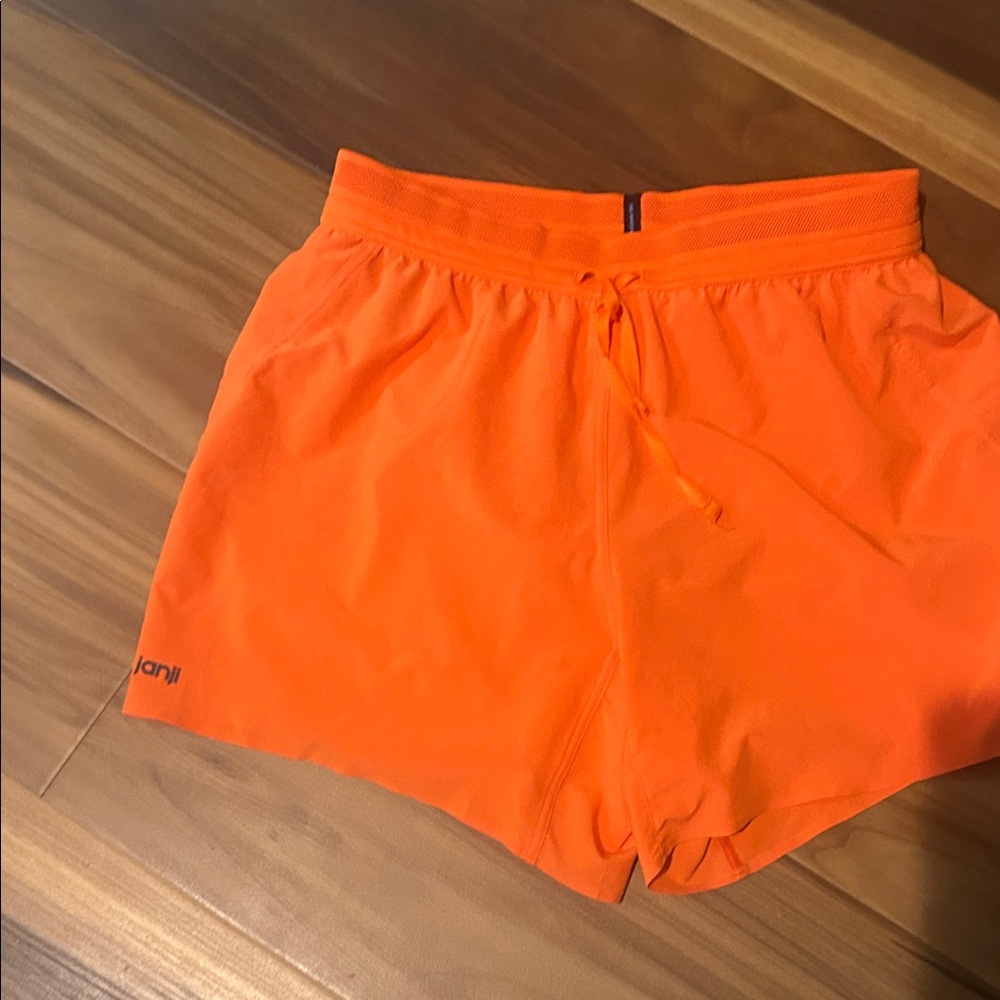 Janji Vibrant Orange Athletic Shorts